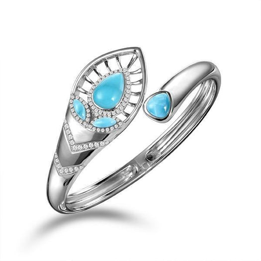The picture shows a 925 sterling silver larimar shrine bangle with topaz.