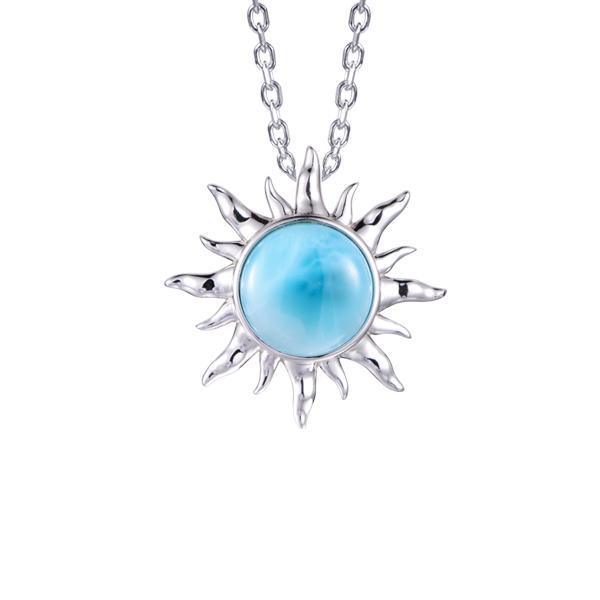 In this picture there is a sun pendant with a blue larimar gemstone set in sterling silver.