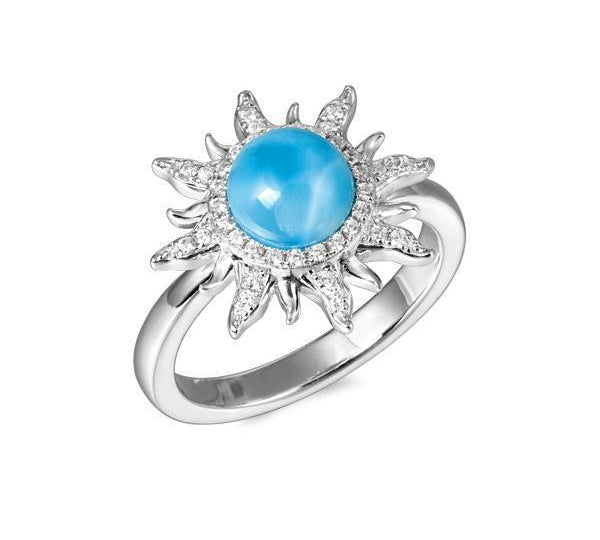 In this photo there is a 925 sterling silver sun ring with a larimar gemstone and topaz