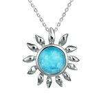 In this photo there is a sterling silver sunflower pendant with one blue larimar gemstone.