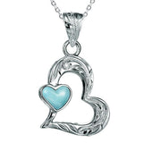 The photo shows a sterling silver larimar pendant featuring a heart shape. 