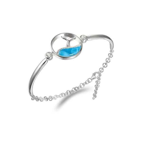 The picture shows a 925 sterling silver larimar whale tail wave bracelet with topaz.