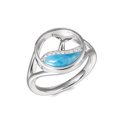 The picture shows a 925 sterling silver larimar whale tail in a wave ring with topaz.