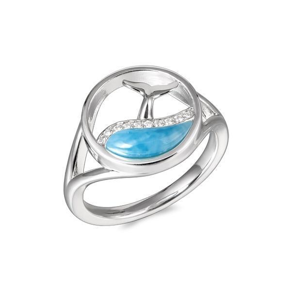 The picture shows a 925 sterling silver larimar whale tail in a wave ring with topaz.
