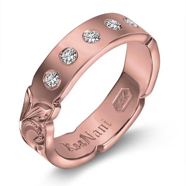 The picture shows a 14K rose gold 4mm ring with hand engravings and diamonds.
