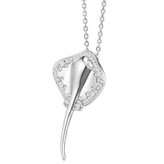 The picture shows a white gold manta ray pendant with topaz.