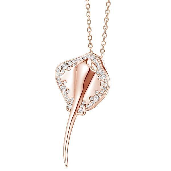The picture shows a rose gold manta ray pendant with topaz.