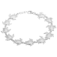 The picture shows a 925 sterling silver white gold-plated sea turtle bracelet with cubic zirconia.