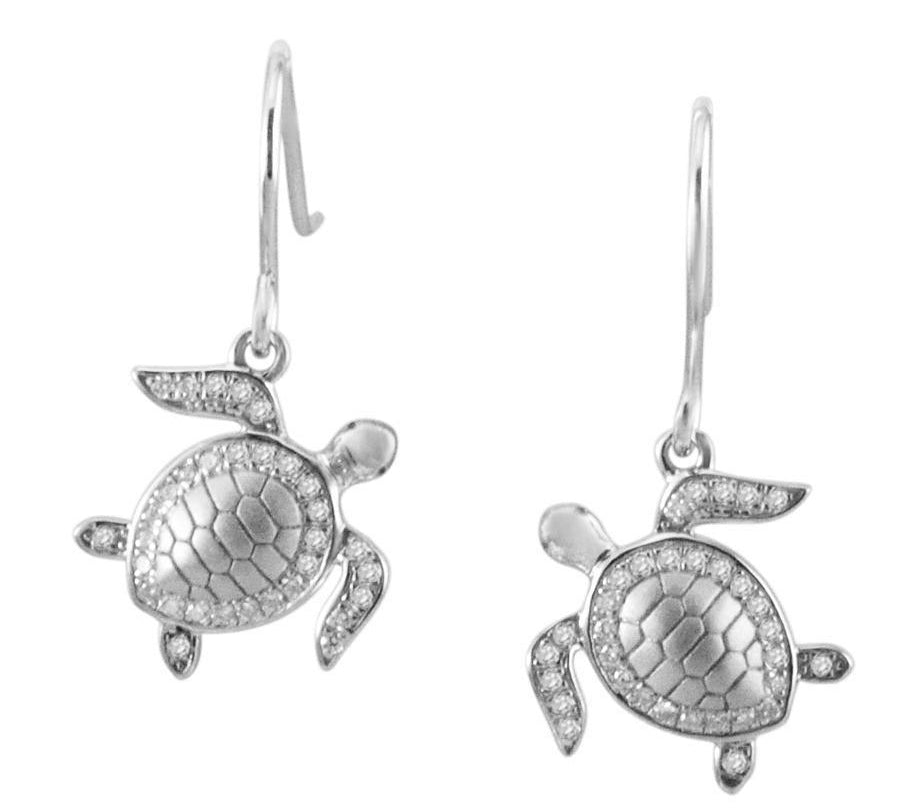 The picture shows a pair of 14K white gold sea turtle hook earrings with diamonds.