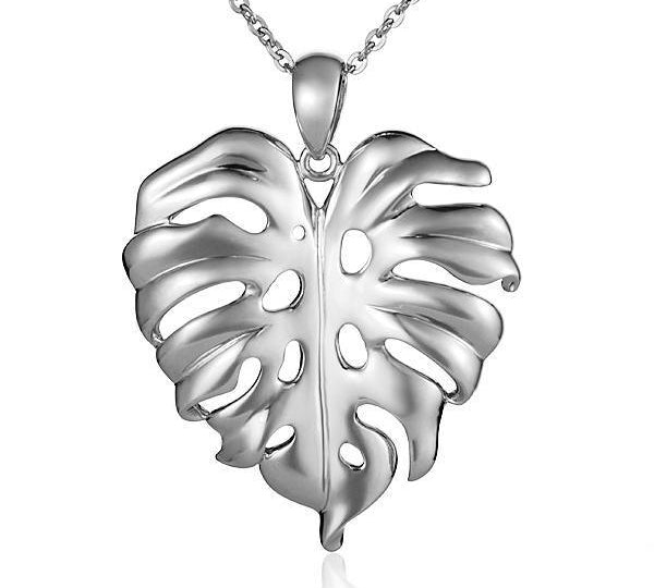 In this photo there is a sterling silver monstera pendant. 