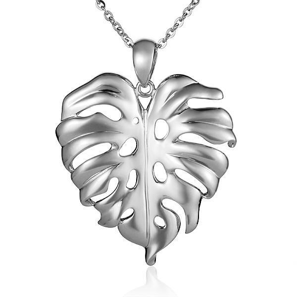 In this photo there is a sterling silver monstera pendant. 