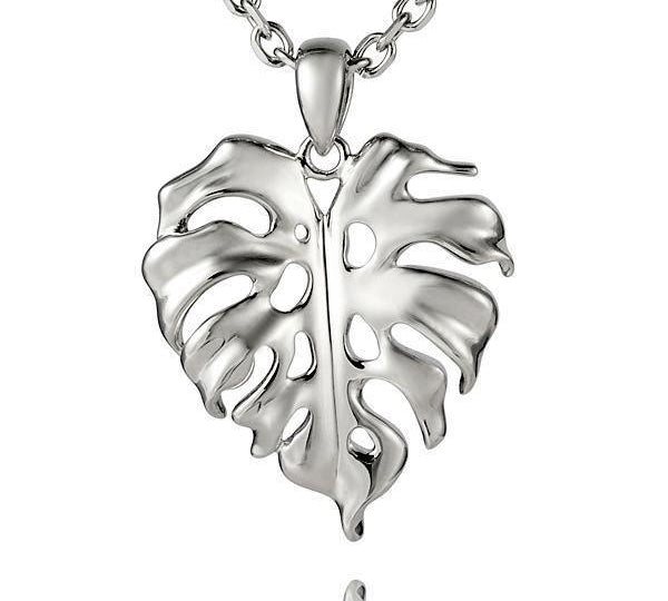 In this photo there is a sterling silver monstera pendant.