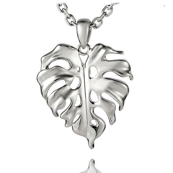 In this photo there is a sterling silver monstera pendant.