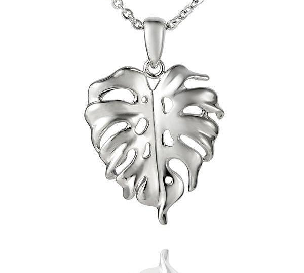 In this photo there is a sterling silver monstera pendant.