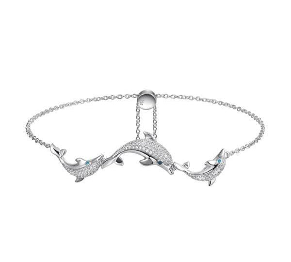 The photo shows a 925 sterling silver three dolphin bolo bracelet with topaz.