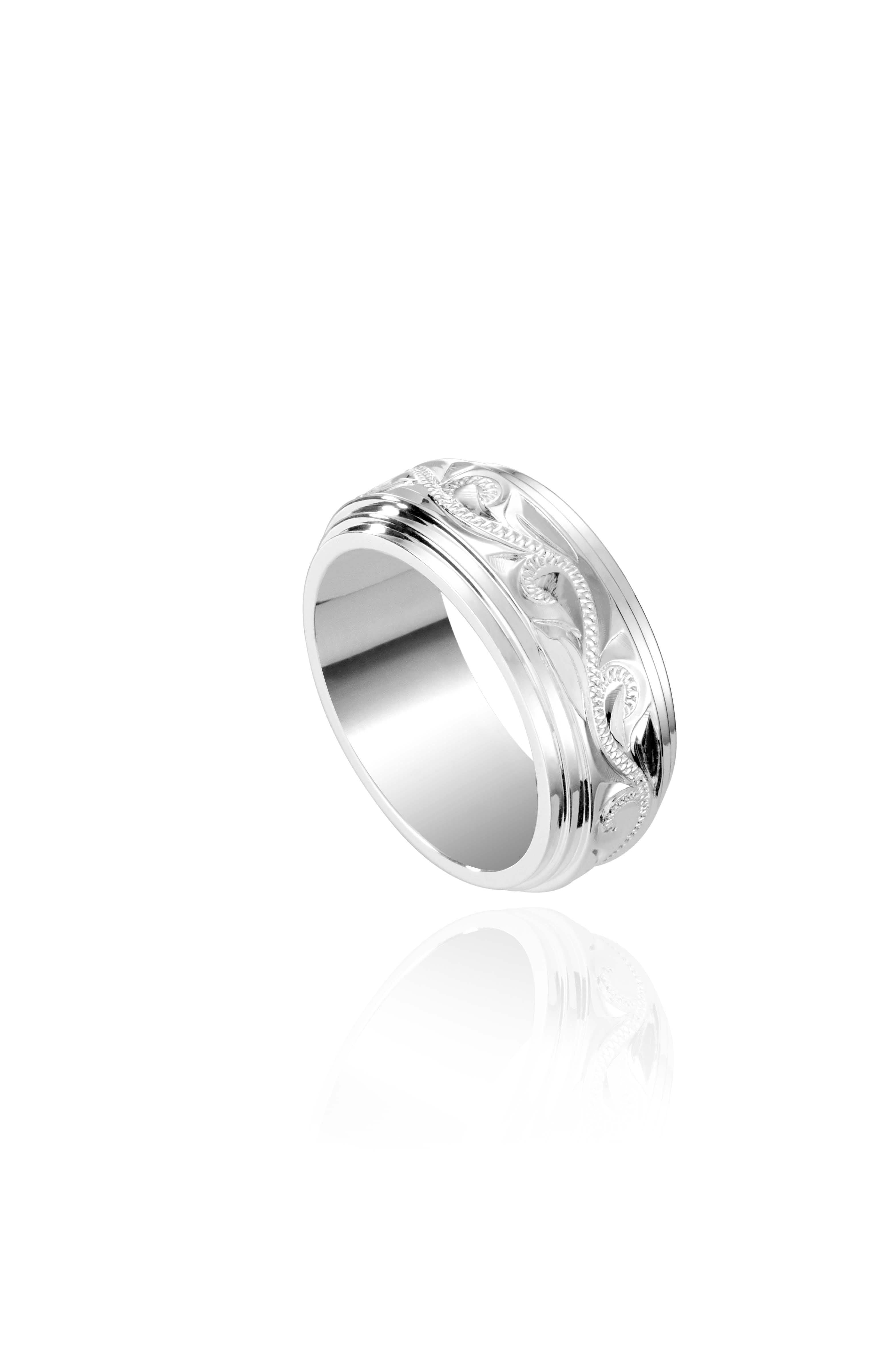 The picture shows a 925 sterling silver 8 mm ring with hand engravings of scrolls.