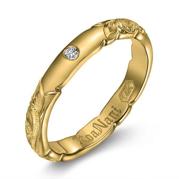 The picture shows a 14K yellow gold diamond 3mm ring with hand engravings and a diamond.
