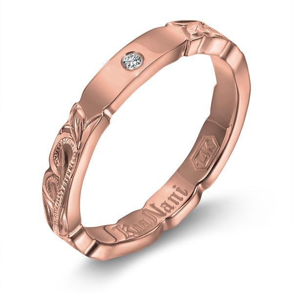 The picture shows a 14K rose gold diamond 3mm ring with hand engravings including a diamond.
