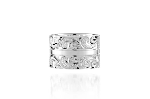 The picture shows a 925 sterling silver 12 mm ring with hand engravings of scrolls.