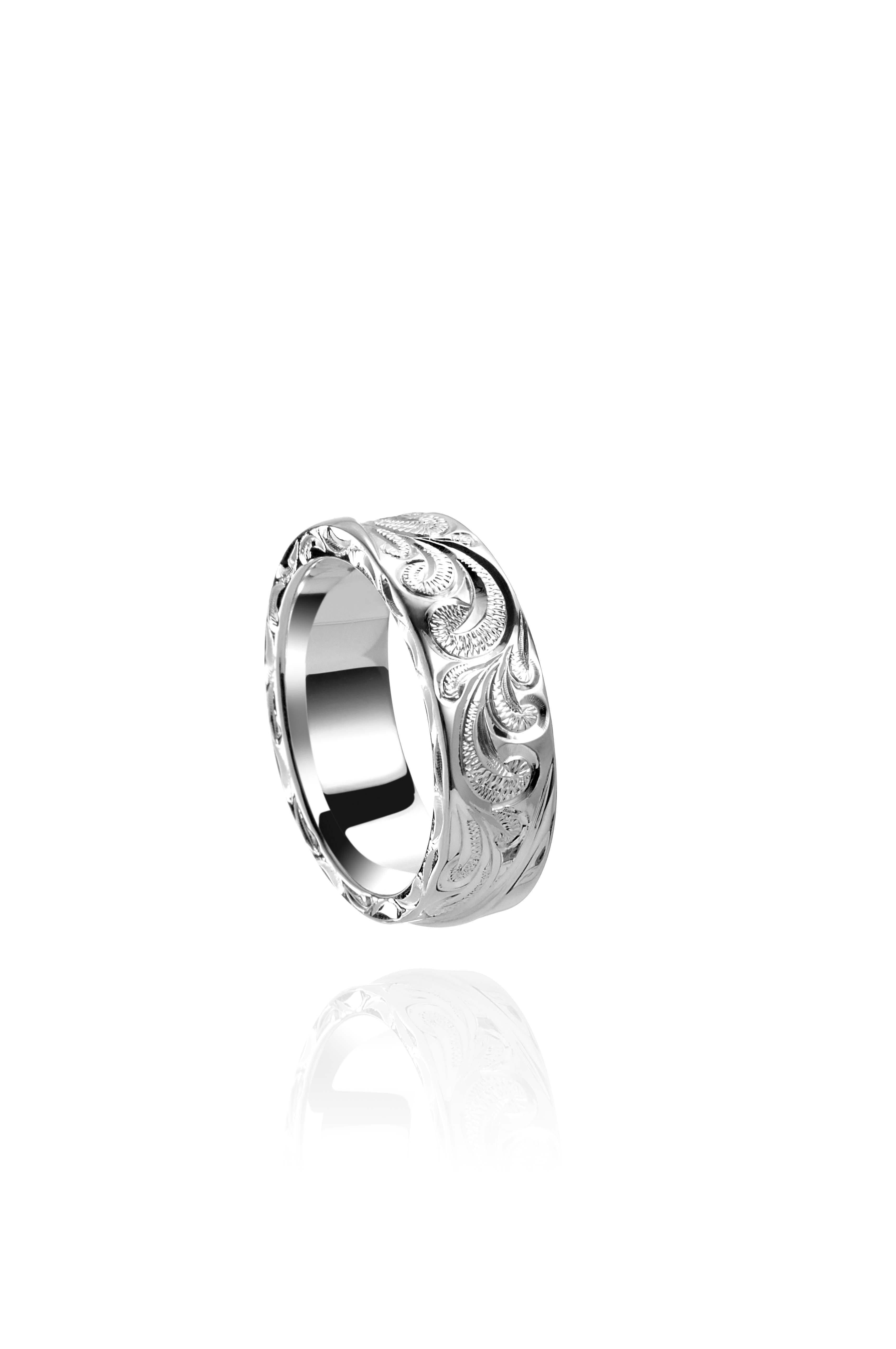 The picture shows a 925 sterling silver wave ring with scroll hand engravings.