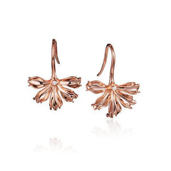 The picture shows a pair of 14K rose gold naupaka flower hook earrings.