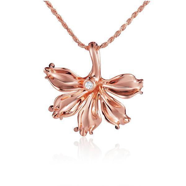In this photo there is a rose gold naupaka flower pendant with one diamond.
