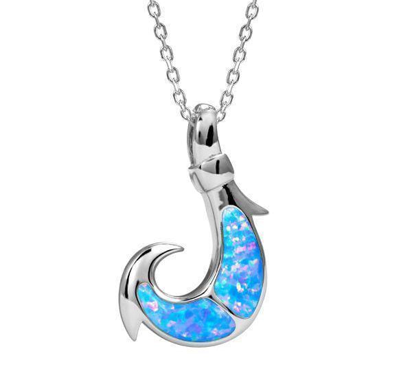 In this photo there is a sterling silver fish hook pendant with blue opalite gemstones.