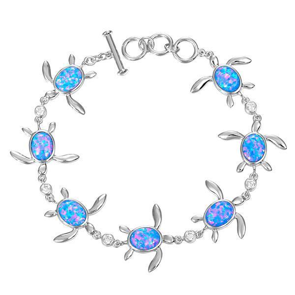 The picture shows a 925 sterling silver opalite sea turtle charm bracelet with cubic zirconia.