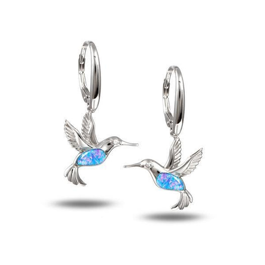 In this photo there is a pair of sterling silver hummingbird dangle earrings with blue opalite and topaz gemstones.