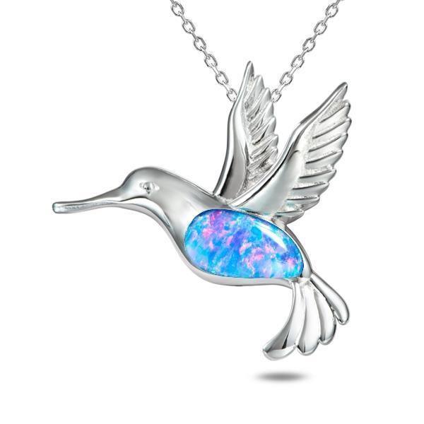 In this photo there is a sterling silver hummingbird pendant with topaz and blue opalite gemstones.