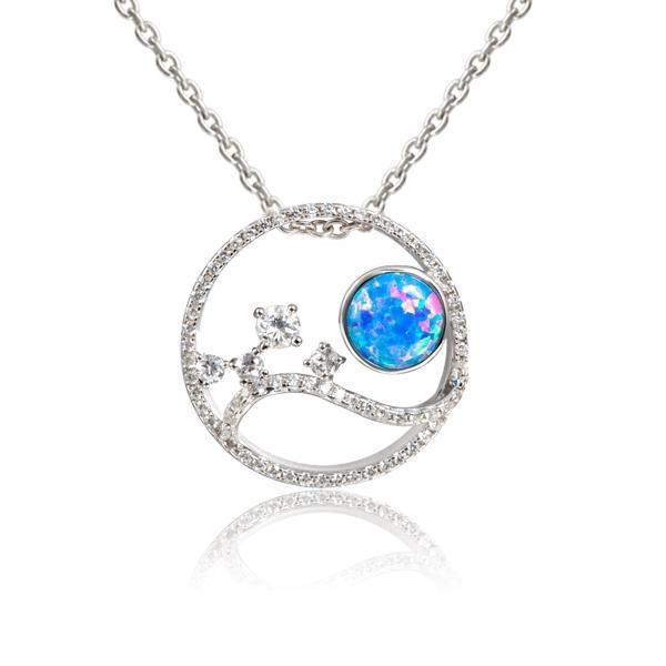 In this photo there is a sterling silver circle pendant with blue opalite, aquamarine and cubic zirconia.