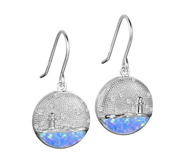 In this photo there is a pair of sterling silver lighthouse medallion hook earrings with blue opalite and topaz gemstones.