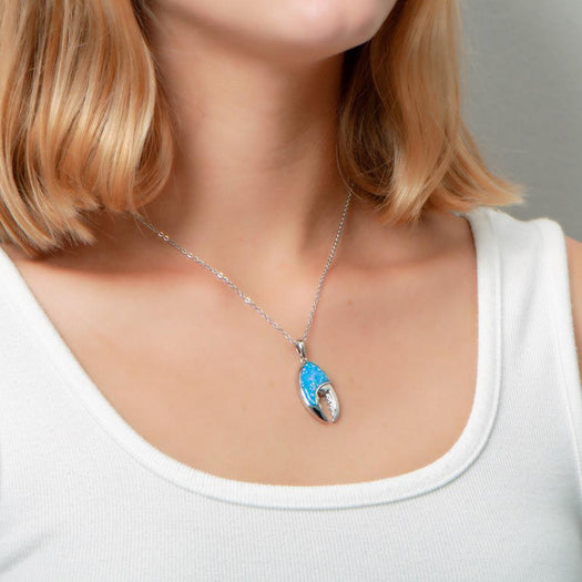 The picture shows a model wearing a 925 sterling silver opalite lobster claw pendant.