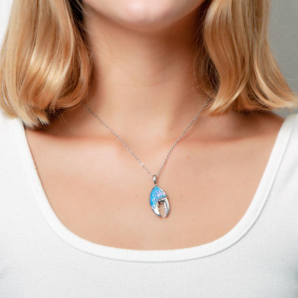 The picture shows a model wearing a 925 sterling silver opalite lobster claw pendant.