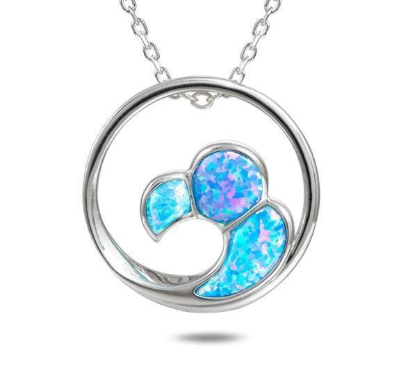 In this photo there is a sterling silver big wave circle pendant with blue opalite gemstones. 