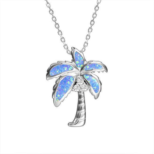 In this photo there is a sterling silver palm tree pendant with blue opalite and three topaz gemstones.
