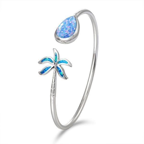 In this photo there is a sterling silver palm tree and teardrop bangle with blue opalite gemstones.