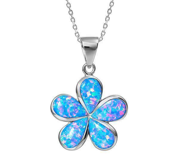 In this photo there is a large sterling silver plumeria pendant with blue opalite gemstones.