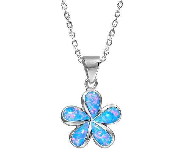 In this photo there is a small sterling silver plumeria pendant with blue opalite gemstones.