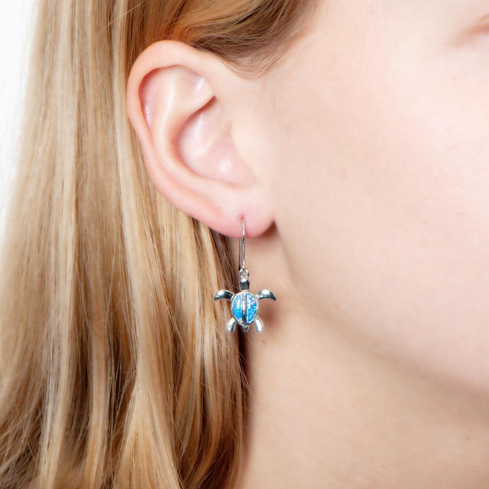 The picture shows a 925 sterling silver opalite sea turtle hook earring.