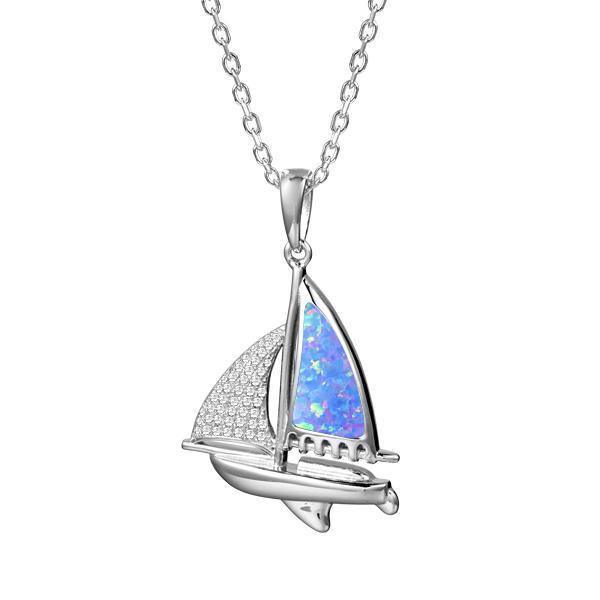 In this photo there is a sterling silver sailboat pendant with blue opalite and topaz gemstones.
