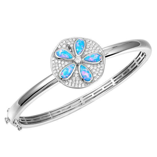 The picture shows a 925 sterling silver sand dollar bangle with blue opalite and topaz.