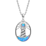 In this photo there is a sterling silver shining lighthouse pendant with blue opalite and topaz gemstones.