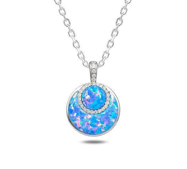 In this photo there is a sterling silver circle pendant with blue opalite and topaz gemstones.