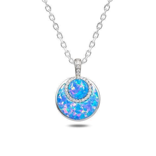 In this photo there is a sterling silver circle pendant with blue opalite and topaz gemstones.