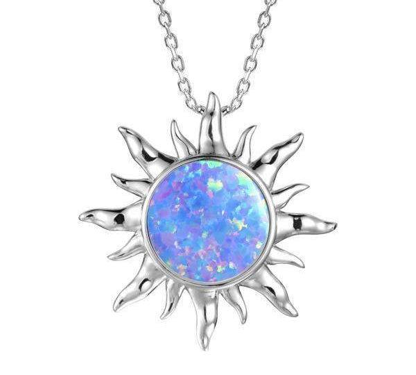 In this photo there is a sterling silver sun pendant with one blue opalite gemstone.