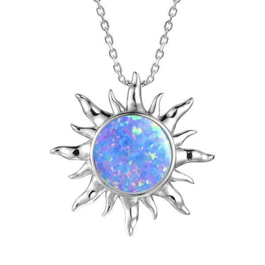 In this photo there is a sterling silver sun pendant with one blue opalite gemstone.