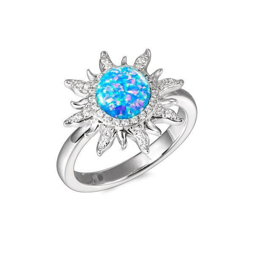 In this picture there is a sunflower ring with blue opalite and topaz gemstones set in 925 sterling silver.