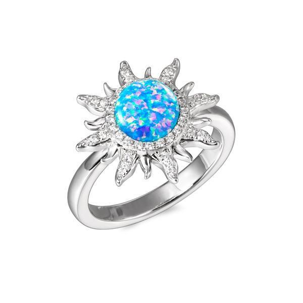 In this picture there is a sunflower ring with blue opalite and topaz gemstones set in 925 sterling silver.