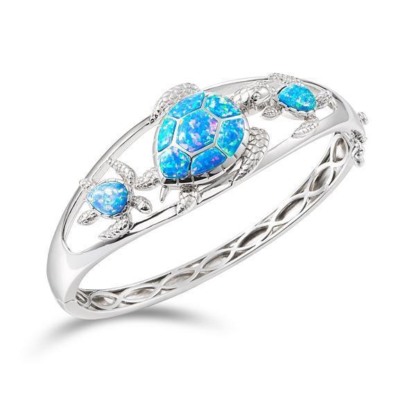 The picture shows a 925 sterling silver opalite three sea turtle bangle.